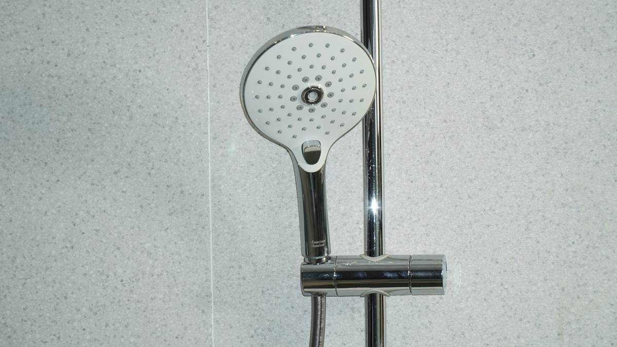 home improvement shower head type feature showing side-by-side comparison of handheld, fixed, and rainfall models in a modern bathroom